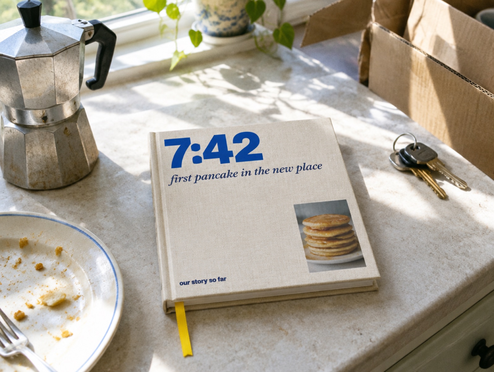 A paper cloth book with a large timestamp on the cover, on a kitchen counter